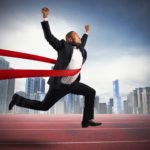 Successful businessman in a finishing line