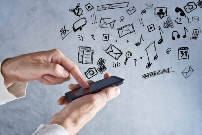Touch screen mobile smart phone in male hands